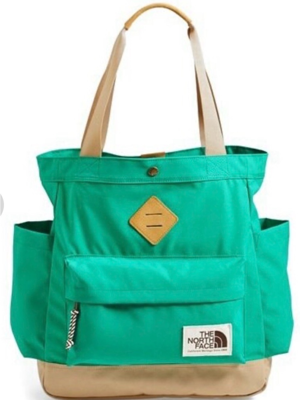The North Face Four Point Waxed Tote in bright turquoise with a tan base